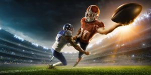 Sport Turf Grass - football player being tackled